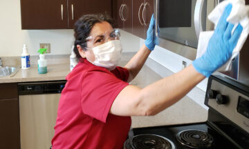 woman cleaning a kitchen