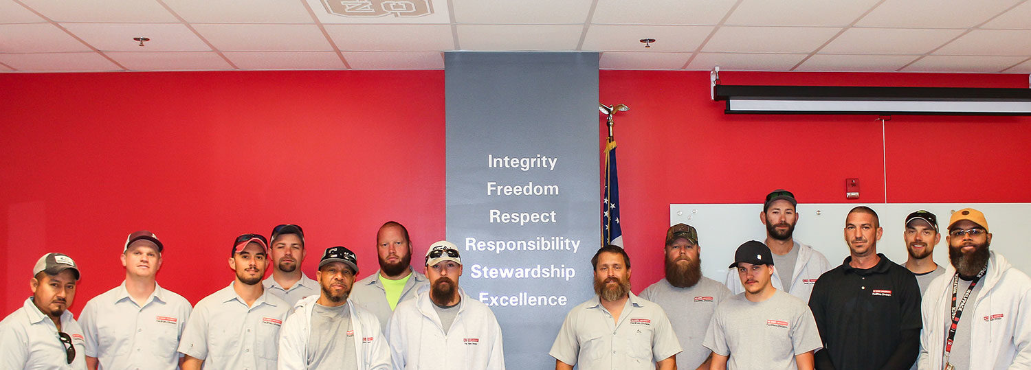 group of Facilities employees standing together